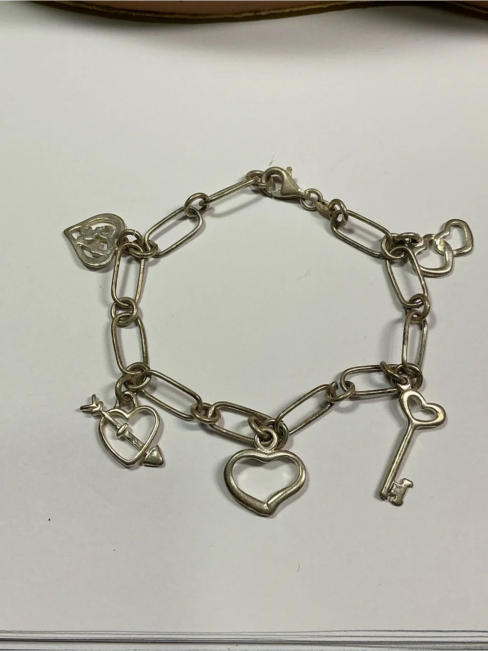 Sterling Silver Link Charm Bracelet W/ 5 Romantic Dangling Charms. 7.25” long